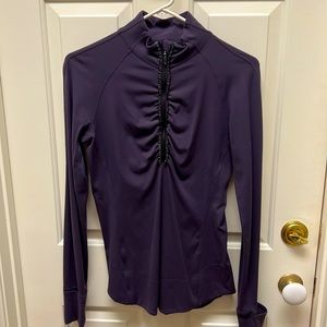 Lululemon purple tight zip up shirt. Awesome ruffle zipper design. Size 6